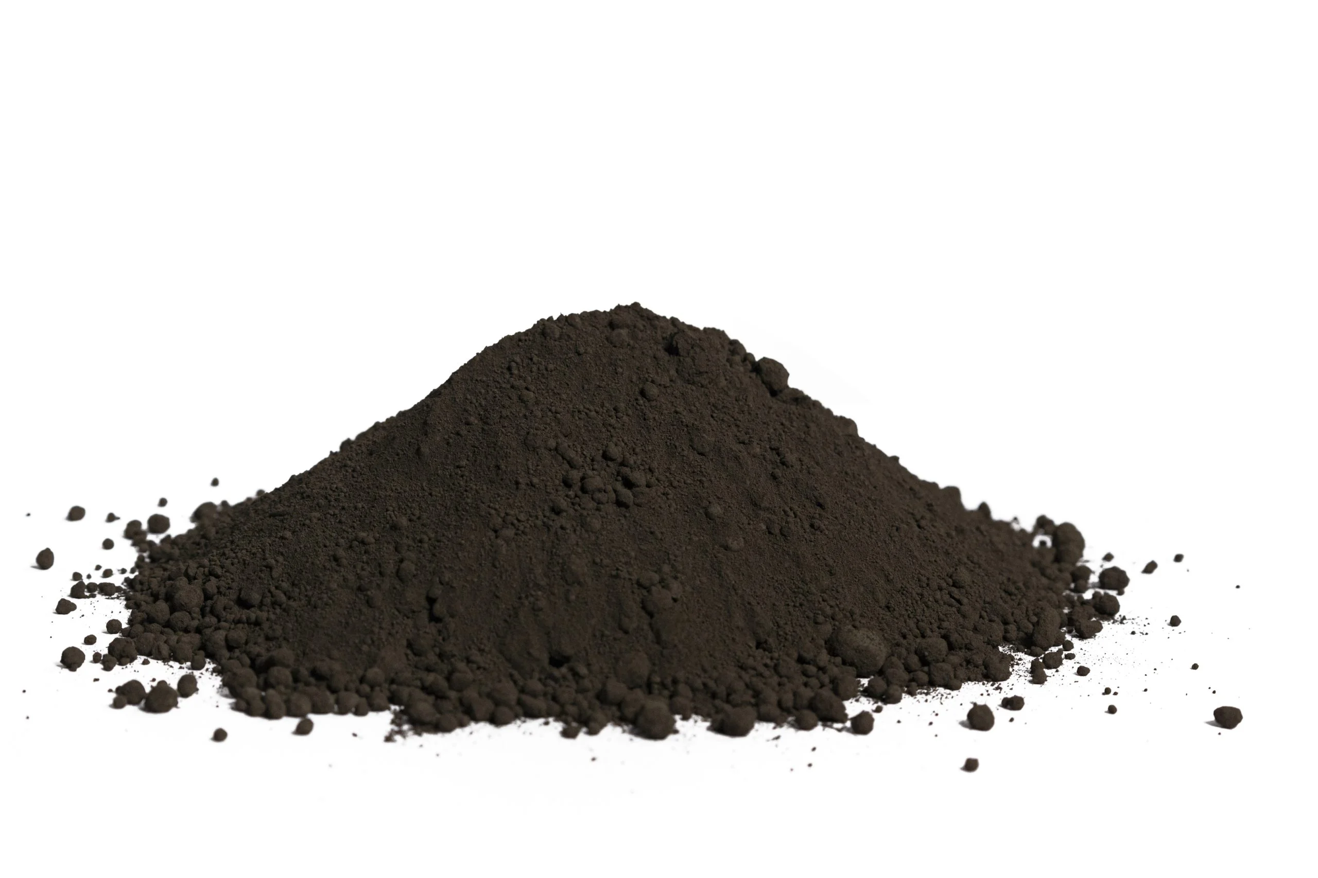 Pile of black powder on white background.