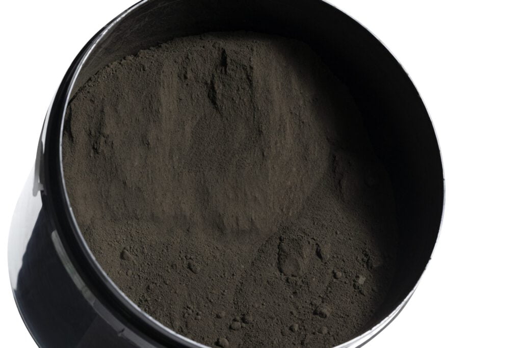 Container filled with dark powder