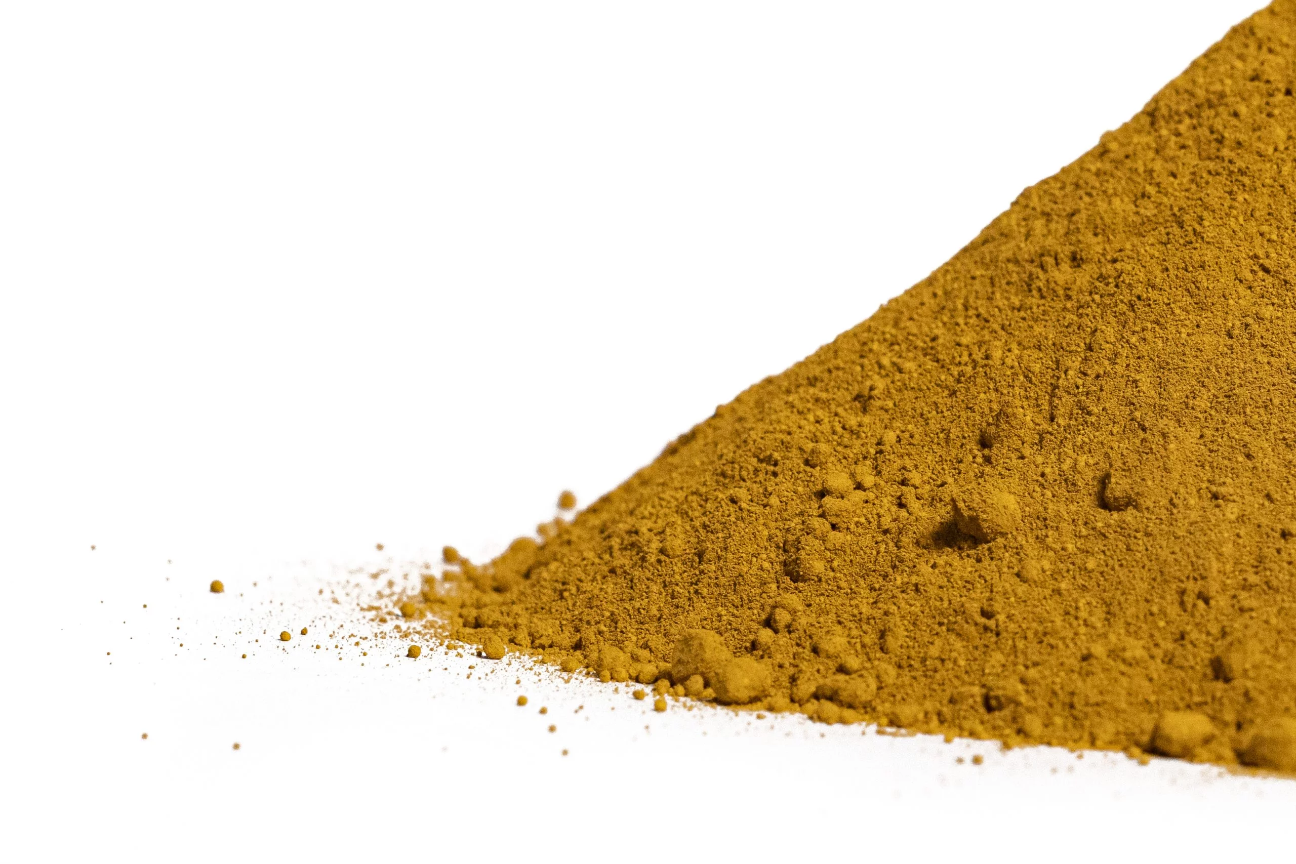 Heap of turmeric powder on white background.