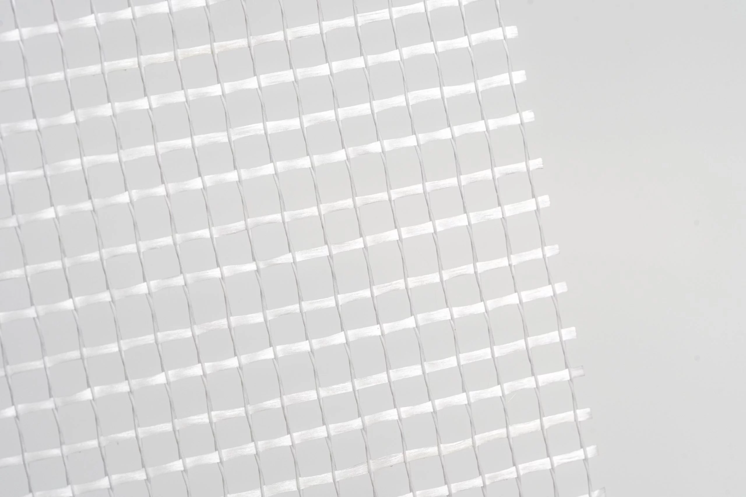 White mesh fabric texture background.