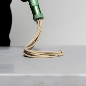 Extruding clay from handheld tool