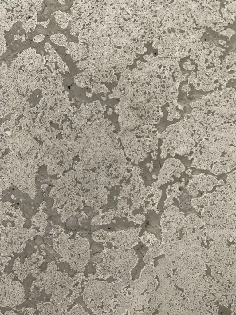 Close-up of textured concrete wall.