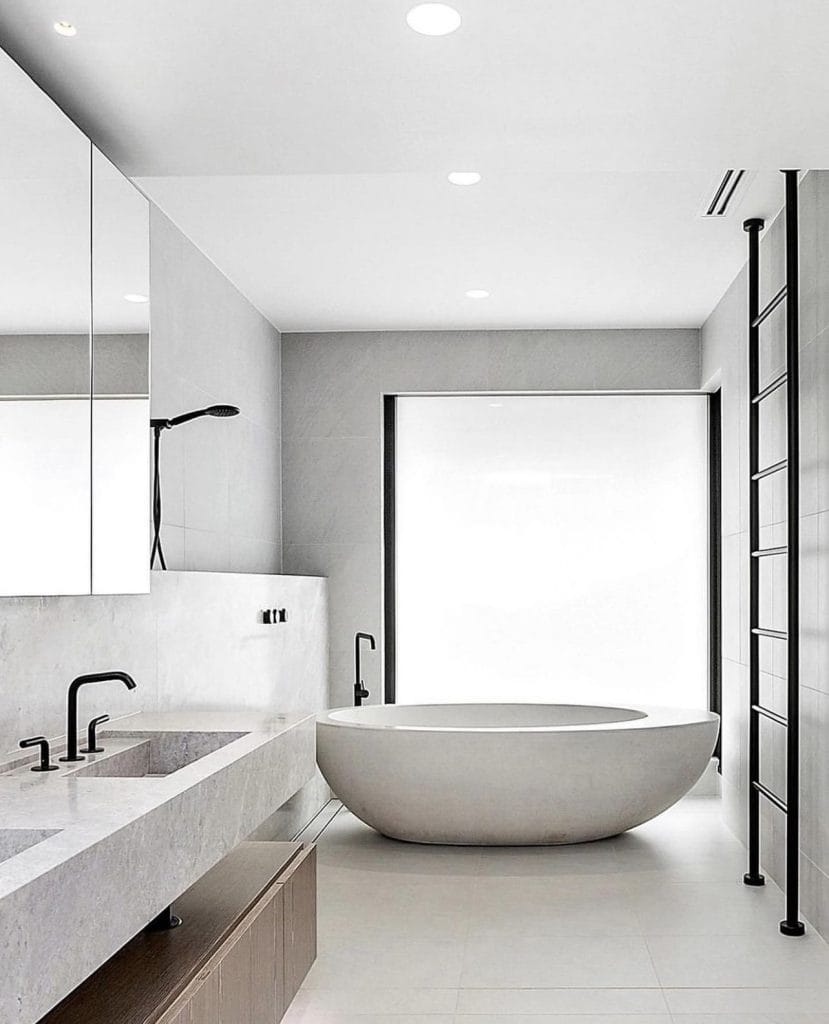 Modern minimalist bathroom with freestanding bathtub.