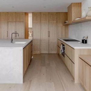 Modern kitchen with wooden cabinets and island.