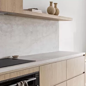 Modern minimalist kitchen with beige cabinets.