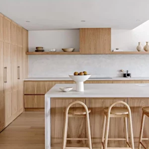 Modern Australian kitchen with wooden cabinets and island.