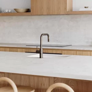 Modern kitchen with wooden cabinets and island sink.