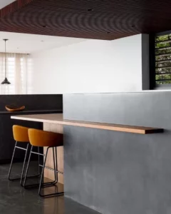 Modern kitchen with bar stools and bench