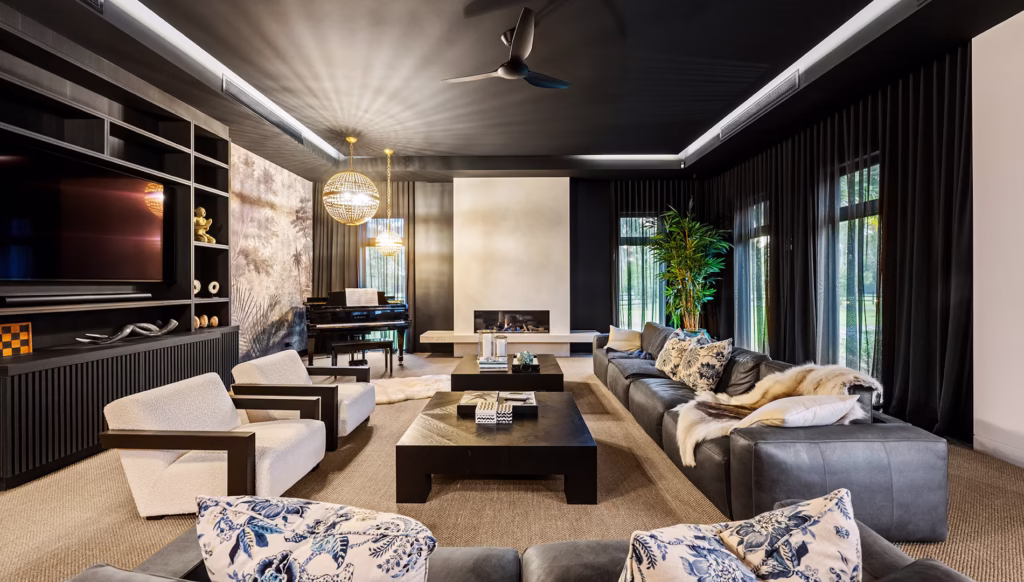 Modern kitchen design with a large central island and bold black details for contrast.